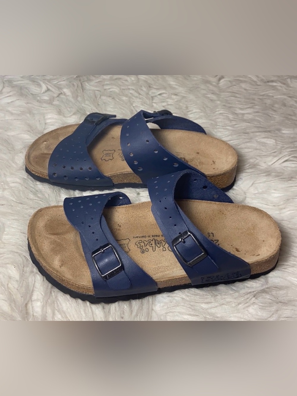 Birki’s navy perforated leather 2 buckle strap Freeport sandals